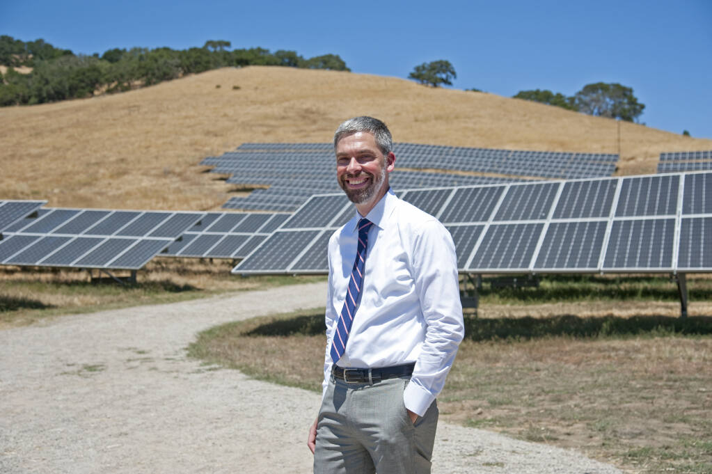 Sonoma Clean Power CEO Geof Syphers is shown in front of one of two 1-megawatt systems in rural Petaluma. The projects have the capacity to power 600 homes. (courtesy photo)