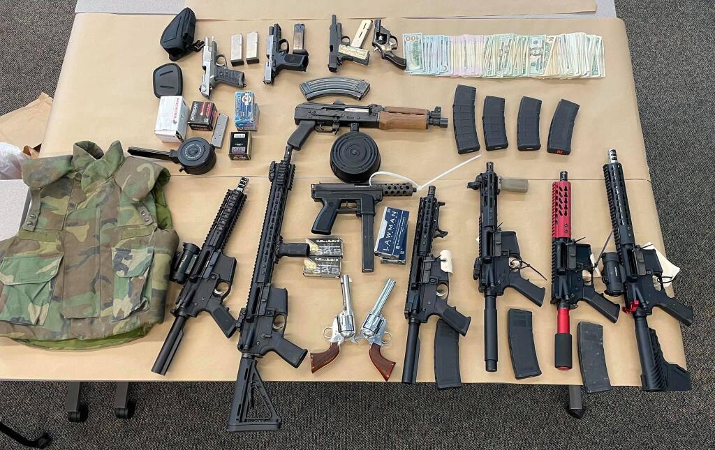 Authorities seized more than a dozen firearms, almost 100 pounds of marijuana, ammunition, body armor and a stolen car from two properties in southwest Santa Rosa. (Sonoma County Sheriff’s Office/Facebook)