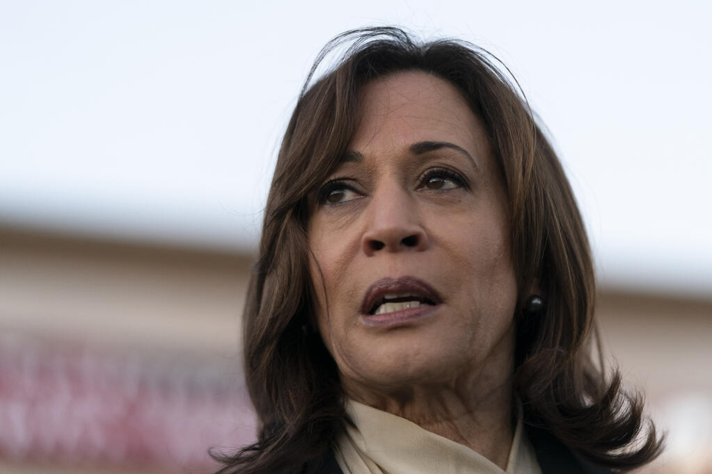 Vice President Kamala Harris talks to the media while visiting a memorial set up outside Star Dance Studio in Monterey Park, Calif., Wednesday, Jan. 25, 2023, to honor the victims killed in last week's mass shooting. (AP Photo/Jae C. Hong)
