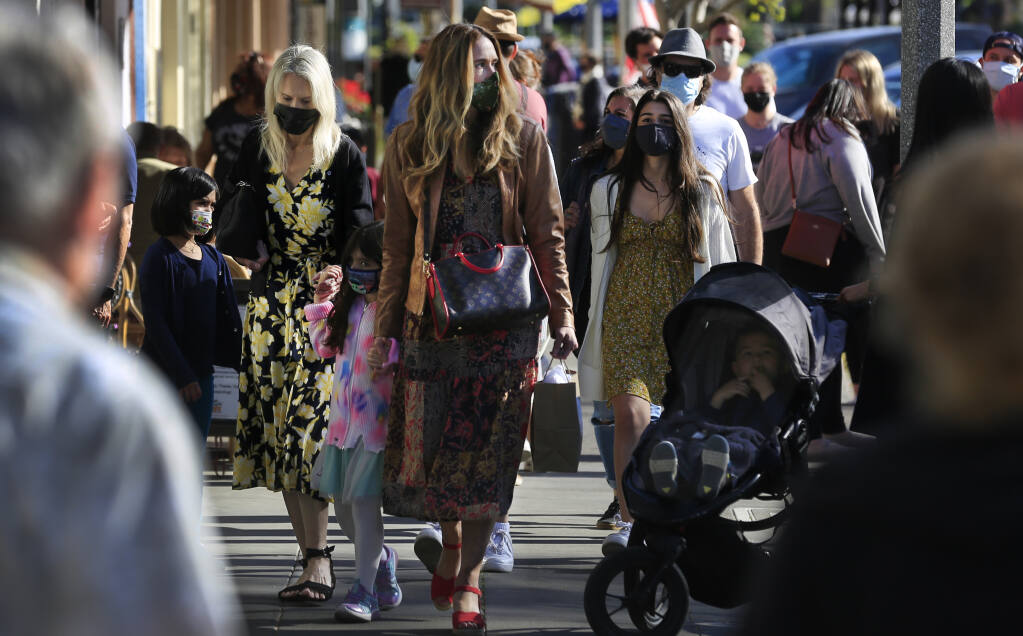 In this file photo, foot traffic is brisk in downtown Sonoma on Saturday, April 10, 2021. The 2021 Portrait of Sonoma County was released by county officials Wednesday. The 44-page review uses government data related to health, education and income to determine how conditions of well-being vary across Sonoma County neighborhoods. (Kent Porter / The Press Democrat, 2021)