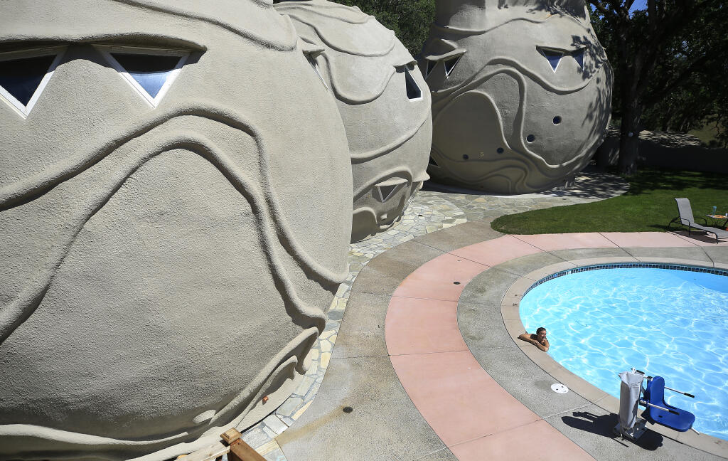 Jenifer Cutler from New York, relaxes in a pool next to rebuilt structures at Harbin Hot Springs near Middletown, Tuesday, May 4, 2021. (Kent Porter / The Press Democrat) 2021