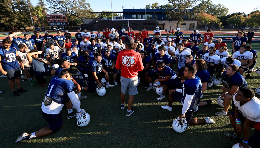 Santa Rosa Junior College Bear Cubs Head football coach Lenny Wagner speaks with the team at the end of practice, Tuesday, August 30, 2022 in Santa Rosa. (Kent Porter / The Press Democrat) 2022