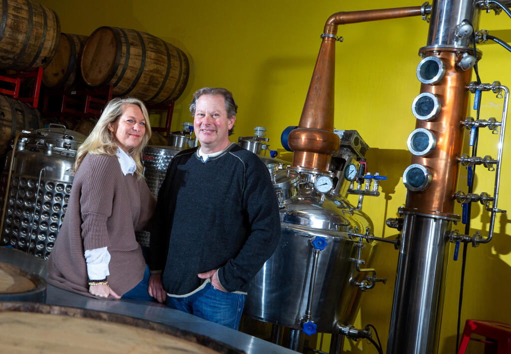 Prohibition Spirits owners Amy and Fred Groth at their distillery in Sonoma, California, on Friday, Jan. 1, 2021. Craft distilleries that pivoted to making hand sanitizer during the COVID-19 pandemic may be required to pay a $14,000 fee by the Food and Drug Administration. (Alvin A.H. Jornada / The Press Democrat)