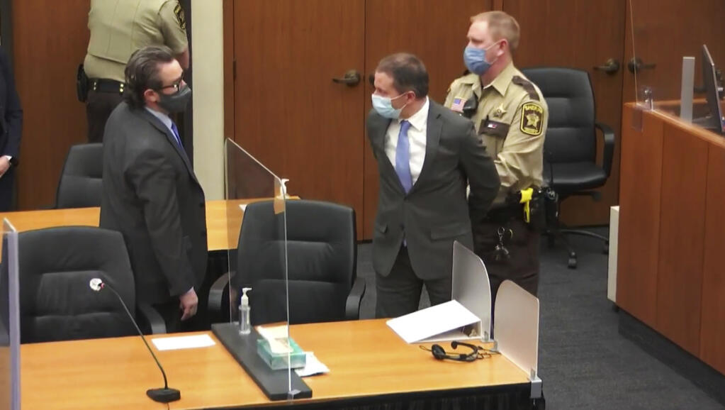 FILE - In this April 20, 2021 file image from video, former Minneapolis police Officer Derek Chauvin, center, is taken into custody as his attorney, Eric Nelson, left, looks on, after the verdicts were read at Chauvin's trial for the 2020 death of George Floyd,, at the Hennepin County Courthouse in Minneapolis, Minn. Nelson has requested a new trial, saying the court abused its discretion when it refused to change the venue in the original proceedings, according to a court document filed Tuesday, May 4, 2021. (Court TV via AP, Pool, File)
