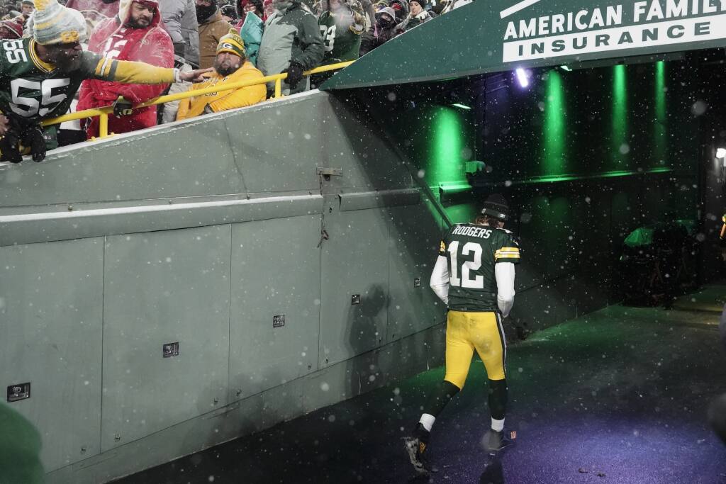 Green Bay Packers' Aaron Rodgers leaves the field after an NFC divisional playoff NFL football game against the San Francisco 49ers Saturday, Jan. 22, 2022, in Green Bay, Wis. The 49ers won 13-10 to advance to the NFC Chasmpionship game. (AP Photo/Morry Gash)