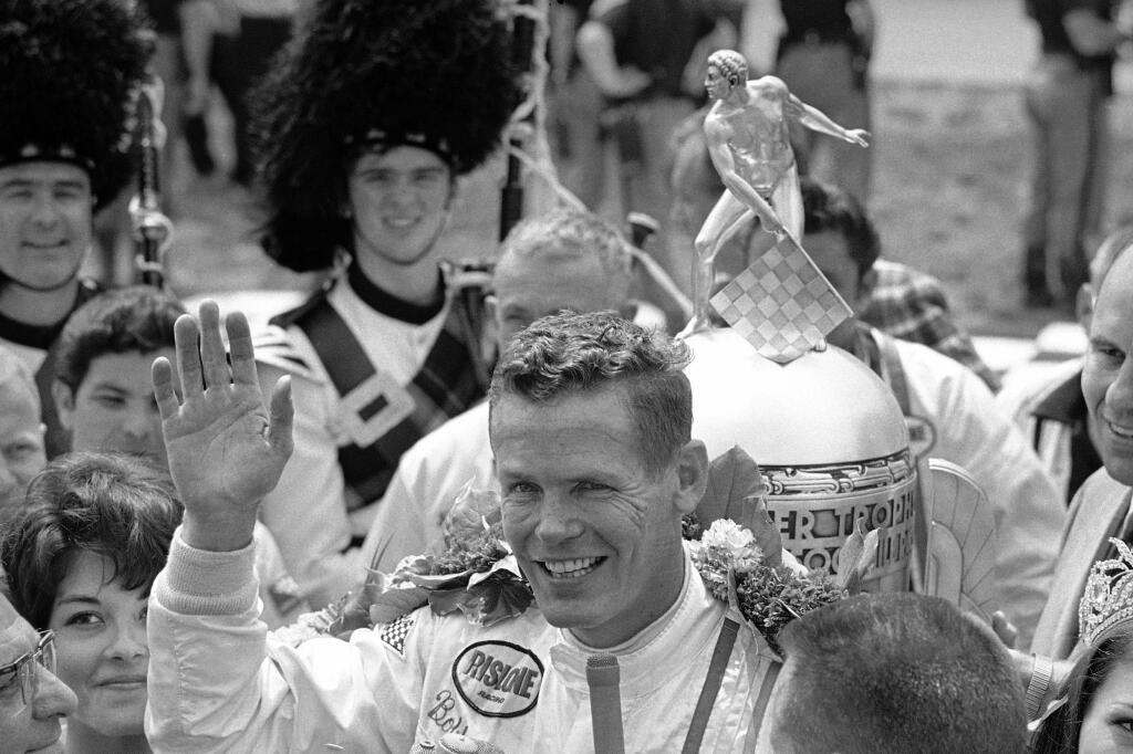 FILE - In this May 30, 1968, file photo, Bobby Unser celebrates winning the 52nd running of the Indianapolis 500 auto race at Indianapolis Motor Speedway in Indianapolis, Ind. Three-time Indianapolis 500 winner Bobby Unser has died. He died of natural causes at his home in Albuquerque, New Mexico, on Sunday, May 2, 2021. He was 87.(AP Photo/File)