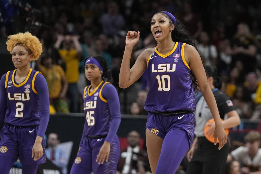 LSU’s Angel Reese waves goodbye after Iowa’s Monika Czinano fouls out during the second half of the April 2 NCAA women’s championship game n Dallas. (Darron Cummings / ASSOCIATED PRESS)