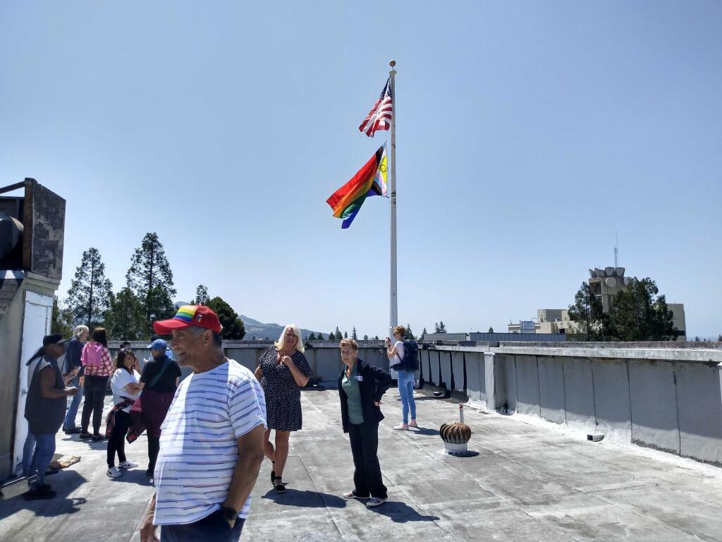 The Pride flag is raised above the Rosenberg building overlooking Old Courthouse Square in Santa Rosa on Thursday, June 1, 2023. (Martin Espinoza/The Press Democrat)