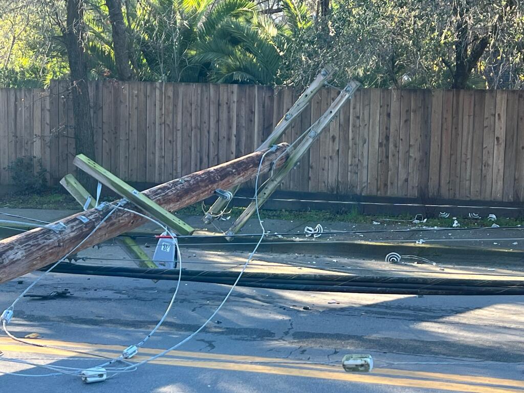 A toppled power pole on Magnolia Avenue in west Petaluma caused some residents to lose power, Friday, Jan. 20, 2023. (Victoria Webb)