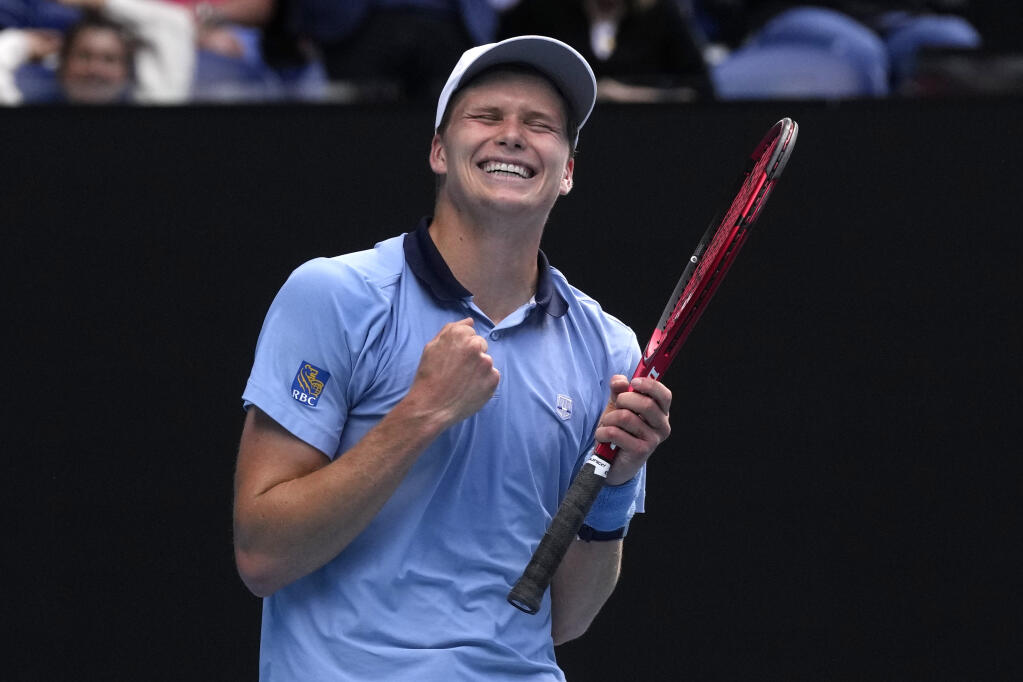 Jenson Brooksby of the U.S. celebrates after defeating Casper Ruud of Norway in Thursday’s second-round match at the Australian Open in Melbourne. (Dita Alangkara / ASSOCIATED PRESS)