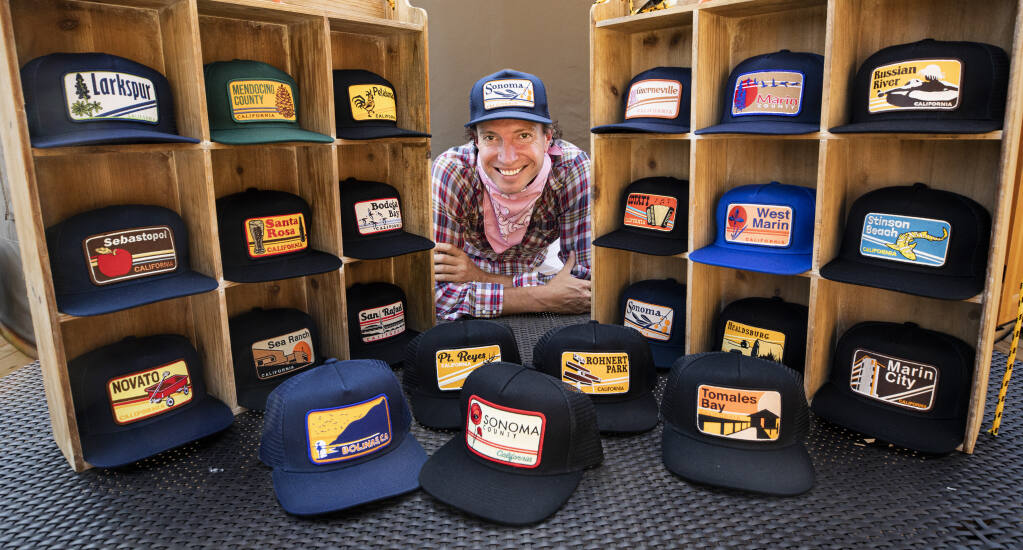 Luke Fraser's company, Bart Bridge, sold unique sports caps and apparel, but with the Warriors sliding and sports events closed due to the coronavirus, Fraser has shifted his designs to caps with Northern California city logos that he designs. Photo taken on Wednesday, Aug. 19, 2020.  (John Burgess/The Press Democrat)