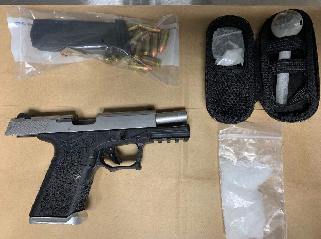 This image shows a handgun and drugs recovered following a chase that occurred on Highway 101 beginning in Healdsburg early Thursday, May 11, 2023. A Santa Rosa man was arrested after the chase ended in San Rafael, police said. (Healdsburg Police Department)