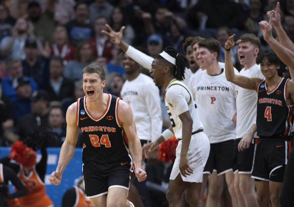 Princeton guard Blake Peters, left screams after making a 3-point shot in the second half of the team’s second-round game against Missouri in the men’s NCAA Tournament, Saturday, March 18, 2023, in Sacramento. Princeton won 78-63. (José Luis Villegas / ASSOCIATED PRESS)