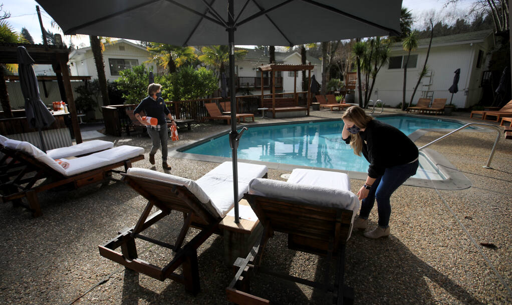 Crista Luedtke owner of Boon Hotel and Spa, left, and general manager Kristen Fisher prepare for essential travelers to the resort, Friday, Jan. 15, 2021, in Guerneville. Kent Porter / The Press Democrat) 2021