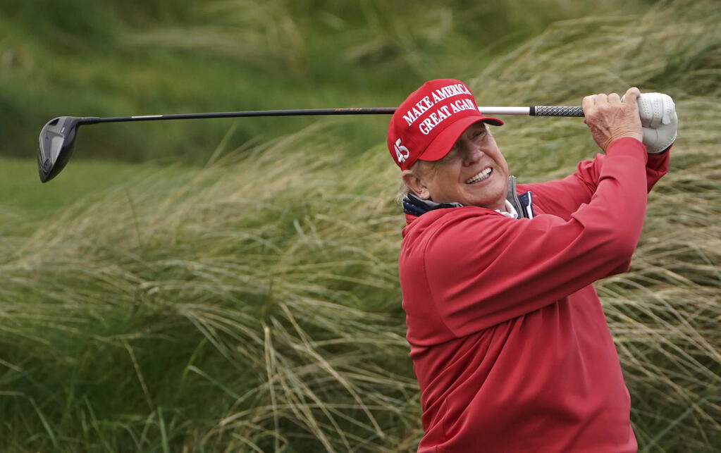 Donald Trump plays golf at Trump International Golf Links & Hotel in Doonbeg, Ireland, Thursday, May 4, 2023, during his visit to Ireland. (Brian Lawless/PA via AP)
