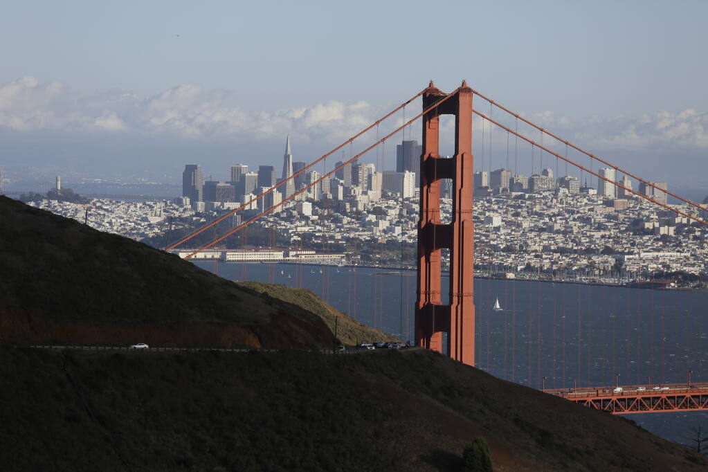 FILE- This Oct. 28, 2015, file photo shows the Golden Gate Bridge and San Francisco skyline from the Marin Headlands above Sausalito, Calif. (AP Photo/Eric Risberg, File)
