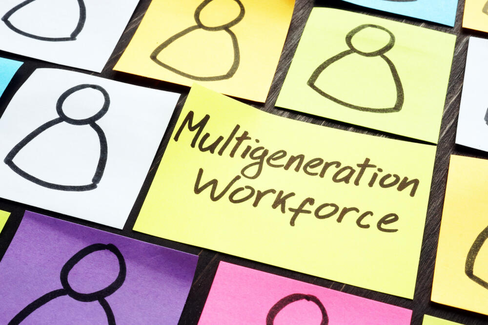 Multigeneration workforce: Multicolored memo stickies with a drawing on each suggesting a person.