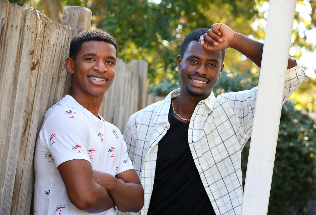 Brothers Teddy, 17, left, and Indy Pelzl, 16, walked 185 miles barefoot when they were 3 and 2 years-old respectively to escape disease and famine in Ethiopia. They lost both of their biological parents on the journey. (Christopher Chung/ The Press Democrat)
