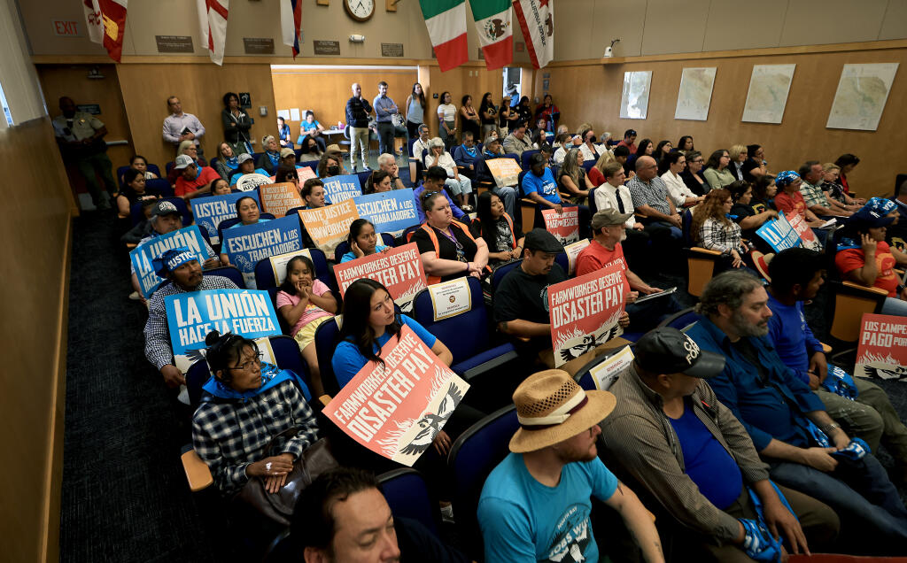 Farmworkers jam the Sonoma County Board of Supervisors meeting in Santa Rosa to listen in on a discussion about the Agricultural Access Verification Program, Tuesday, Sept. 19, 2023. A rally outside the meeting was organized by North Bay Jobs with Justice. (Kent Porter / The Press Democrat)