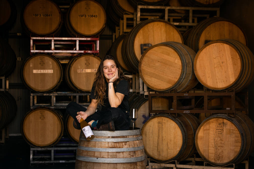Rosalind Reynolds is an assistant winemaker for Pax Wines in Sebastopol’s Barlow district and makes about 1500 cases of her own label, Emme Wines. Photographed in the barrel room Wednesday, November 16, 2022. (John Burgess/Press Democrat)