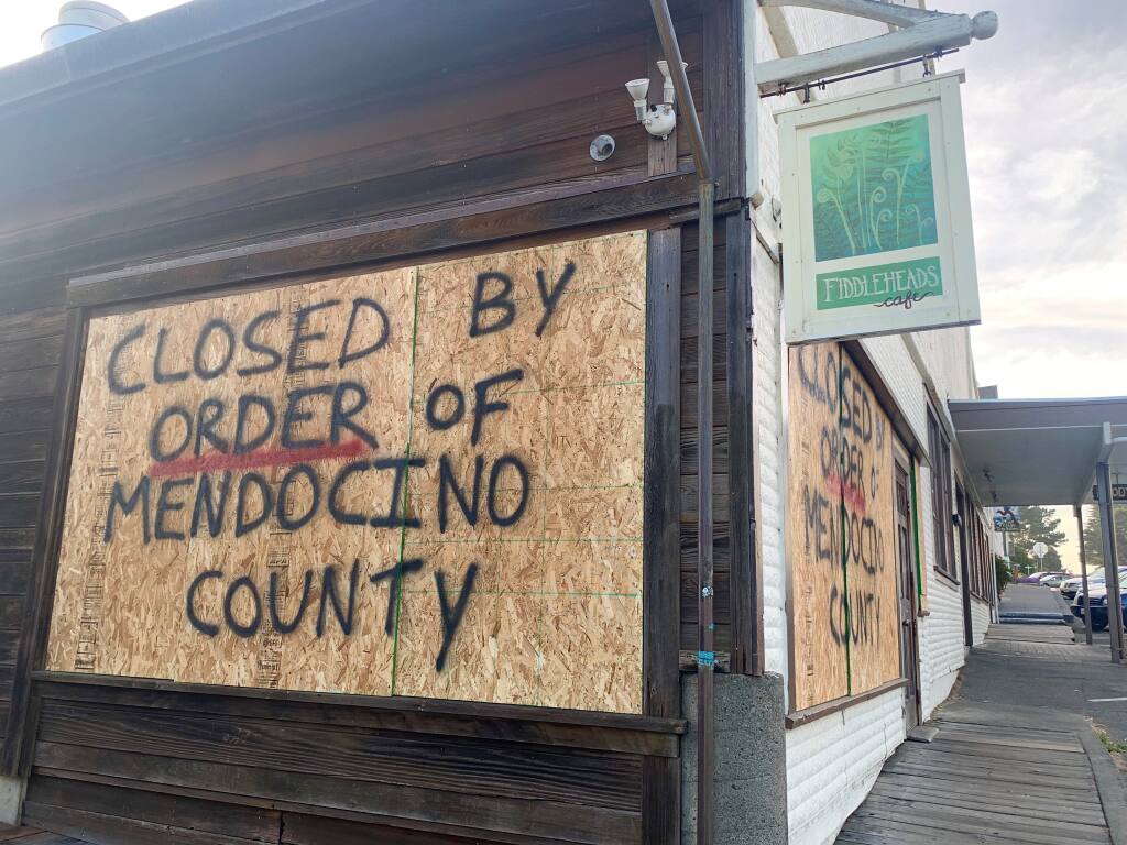Fiddleheads Cafe owner Chris Castleman boarded up his Mendocino restaurant over the weekend after Mendocino County threatened him with a second $10,000 fine for violating  provisions in the county health order, including failures to require employees to wear face coverings or post necessary signage concerning mandated social distancing and hygiene protocols. (Photo courtesy of Scott Roat)