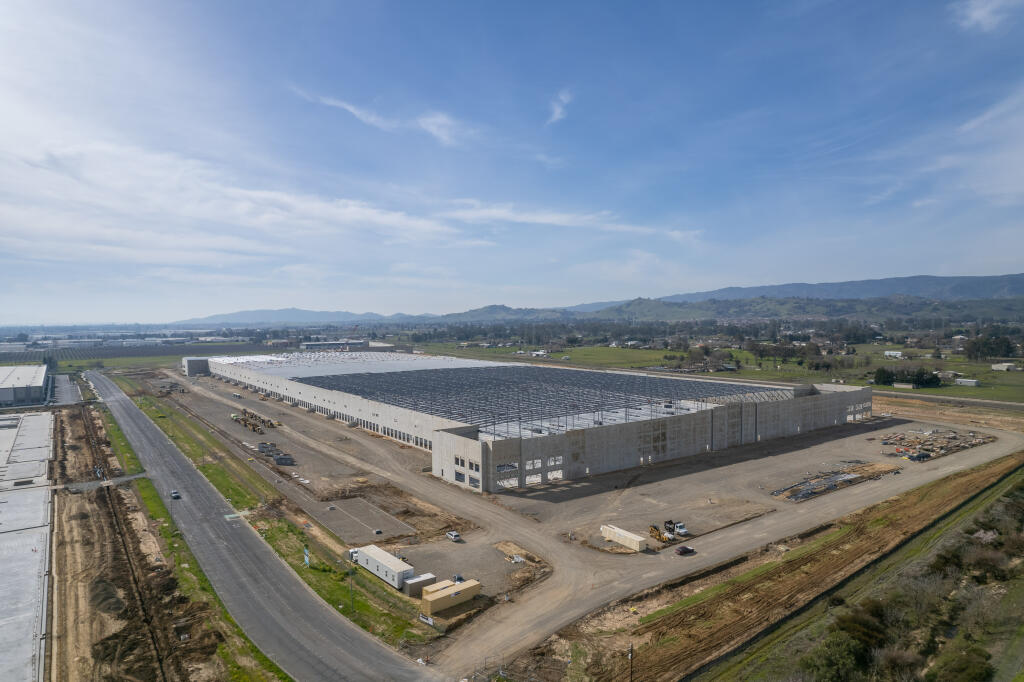 Half the roof of the 1.23 million-square-foot Building C warehouse at the Midway Commerce Center project in Vacaville is seen in this drone image looking southwest across Eubanks Drive on Monday, Feb. 20, 2023. (courtesy of Cushman & Wakefield)