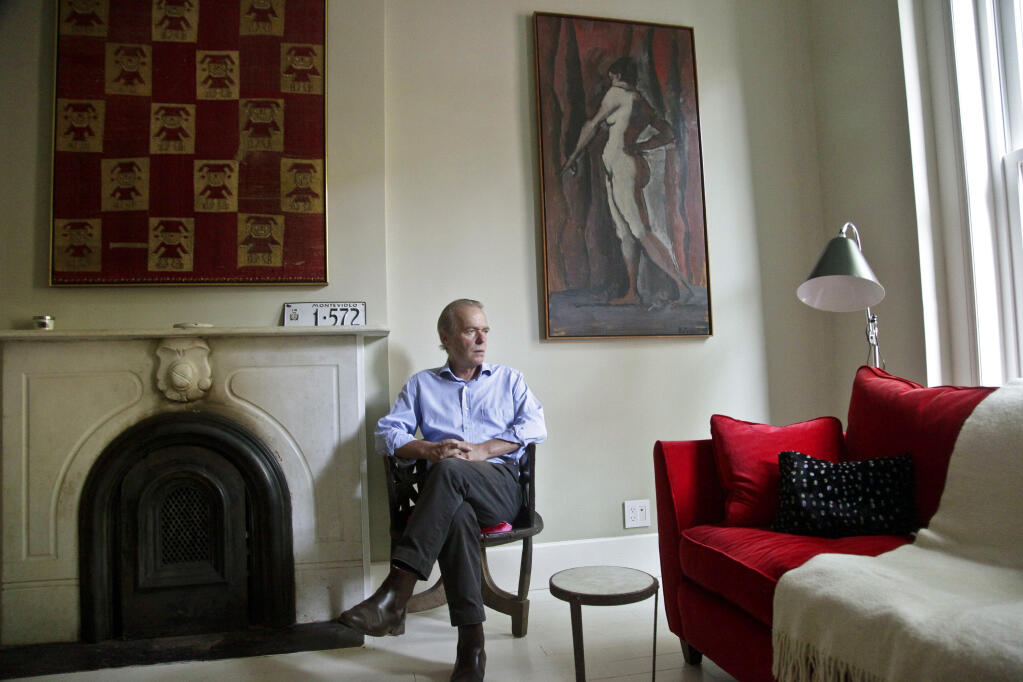 FILE - British novelist Martin Amis poses in the living room of his new home in the Brooklyn borough of New York on Aug. 17, 2012. Amis, who brought a rock ‘n’ roll sensibility to his stories and lifestyle, has died. He was 73. His death, from cancer of the esophagus, was confirmed by his agent, Andrew Wylie, on Saturday, May 20, 2023.(AP Photo/Bebeto Matthews, File)
