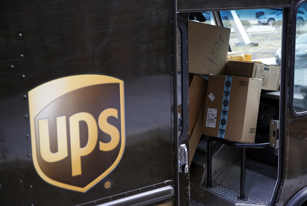 In this photo from Dec. 19, 2018, packages await delivery inside of a UPS truck. (FILE PHOTO)