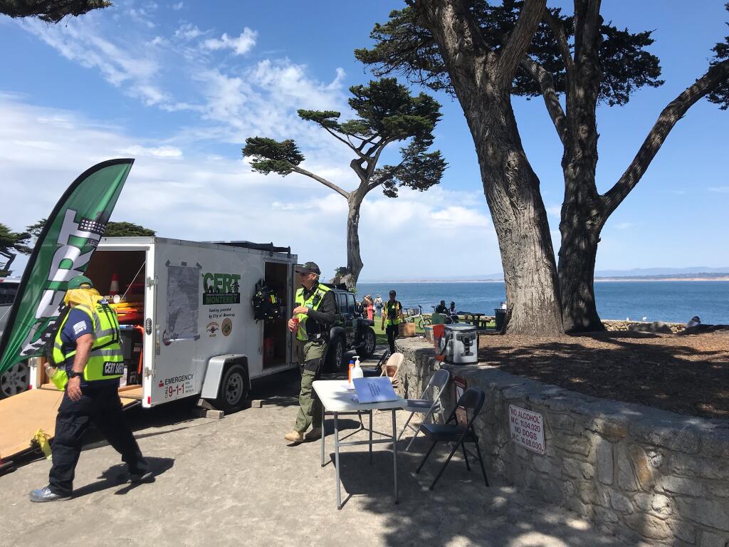 C.E.R.T, a Community Emergency Response Team, joined forces with the Pacific Grove Police and Fire departments to guard the beach and ensure that no one went near the ocean after a shark attack on Wednesday, June 22, 2022. (Kylie Lawrence / The Press Democrat)
