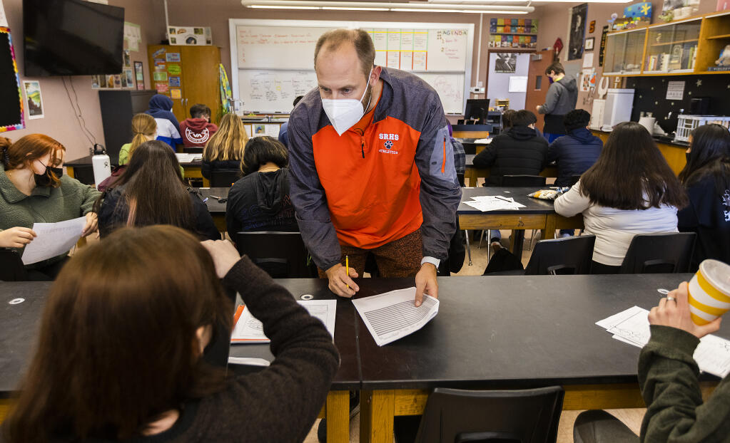 Santa Rosa high school physical education teacher Ryan Terschuren takes attendance as a substitute in a science class on Friday, January 07, 2022. Terschuren has worked 48 days in a row as a substitute during his normal prep period. (Photo by John Burgess/The Press Democrat)