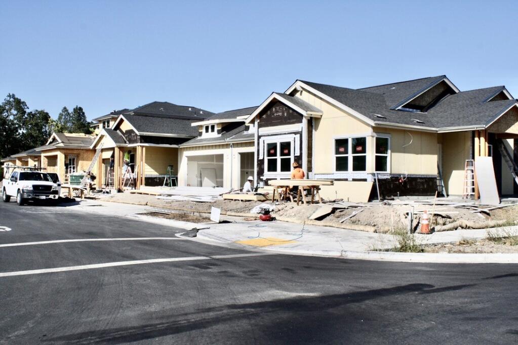 More than a third of the new single family homes and six duets are still under construction at Portello in Windsor near the Walmart Center. (Gary Quackenbush Photo)