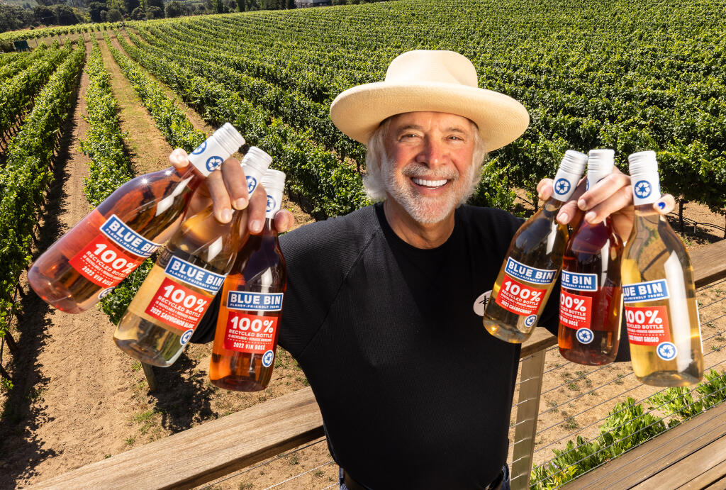 Ron Rubin, owner of Ron Rubin Winery in Sebastopol, created his Blue Bin line of wines using a 100% recycled plastic bottle. The bottles are so light he can carry three bottles in each hand. Photo taken in Graton, Friday, Aug. 4, 2023. (John Burgess / The Press Democrat)