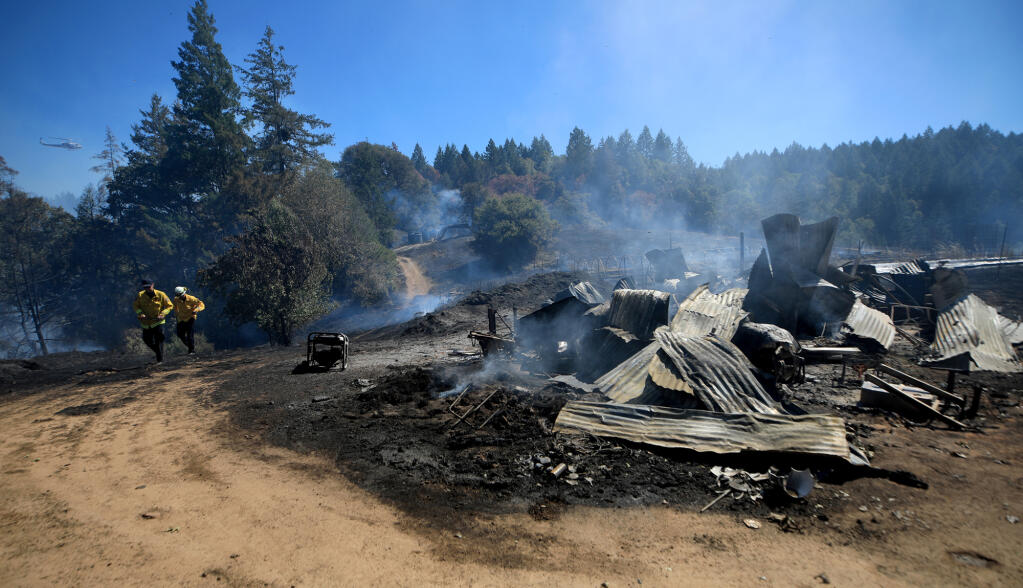 Two structures had been destroyed Tuesday, July 19, 2022, by the Meadow Fire, officials said in a 7 p.m. update. The blaze, just northwest of Boonville in Mendocino County, also had scorched nearly 17 acres of land and was 50% contained. (Kent Porter / The Press Democrat) 2022