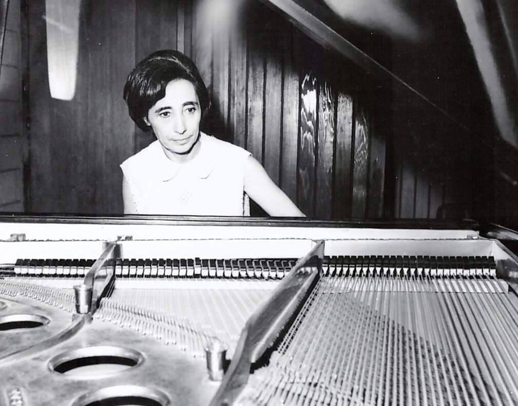 Erna Salm at the keyboard of piano that survived Nazi theft and German bombs. (FAMILY PHOTO)