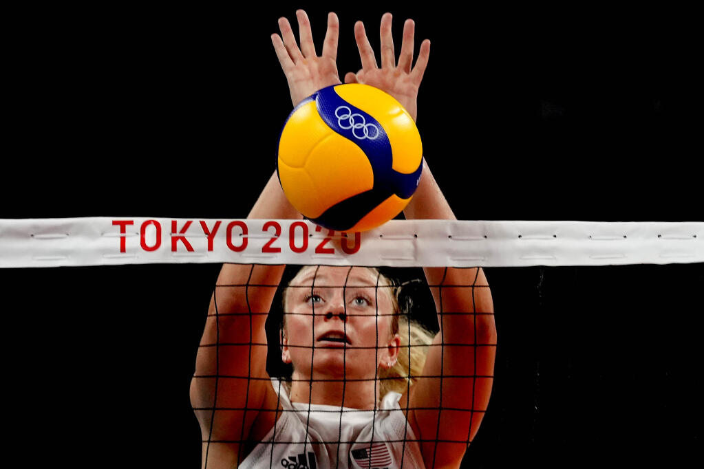 FILE - Olympian Jordyn Poulter blocks the ball during the women's volleyball preliminary round pool B match between China and the United States at the 2020 Summer Olympics, on July 27, 2021, in Tokyo, Japan. A Southern California man received a jail sentence after admitting he stole an Olympic gold medal from Jordyn Poulter. Poulter reported the medal stolen on May 25 after the Olympian found her car broken into at a parking garage in Anaheim. Jordan Fernandez of Anaheim pleaded guilty to felony charges, including burglary. (AP Photo/Frank Augstein, File)