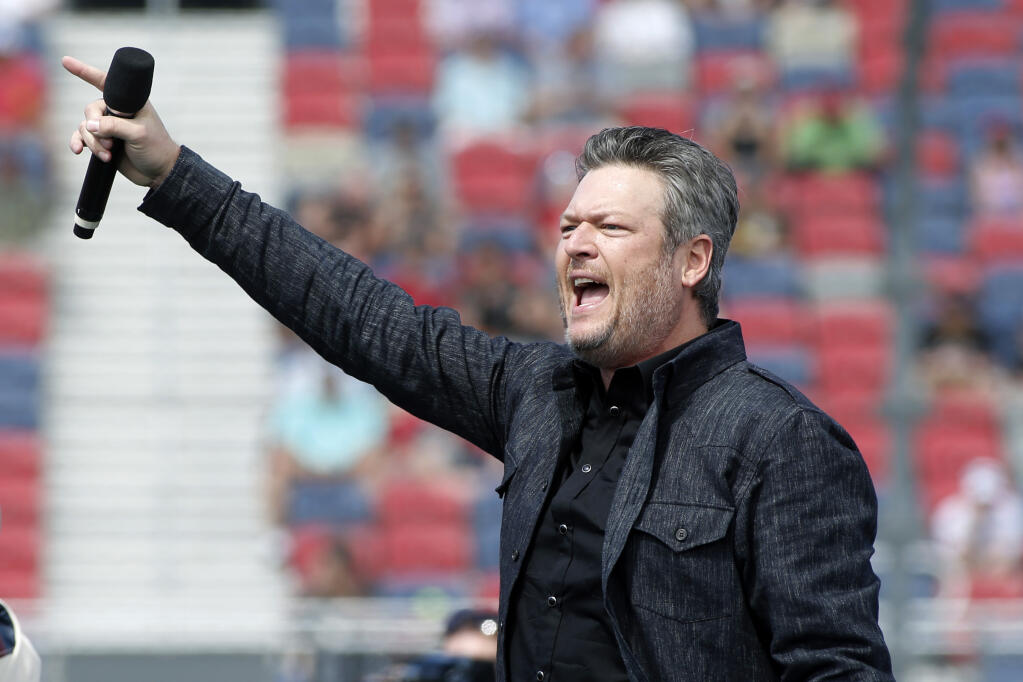 Country music singer and television personality Blake Shelton performs prior to a NASCAR Cup Series auto race at Phoenix Raceway, Sunday, March 8, 2020, in Avondale, Ariz. (AP Photo/Ralph Freso)