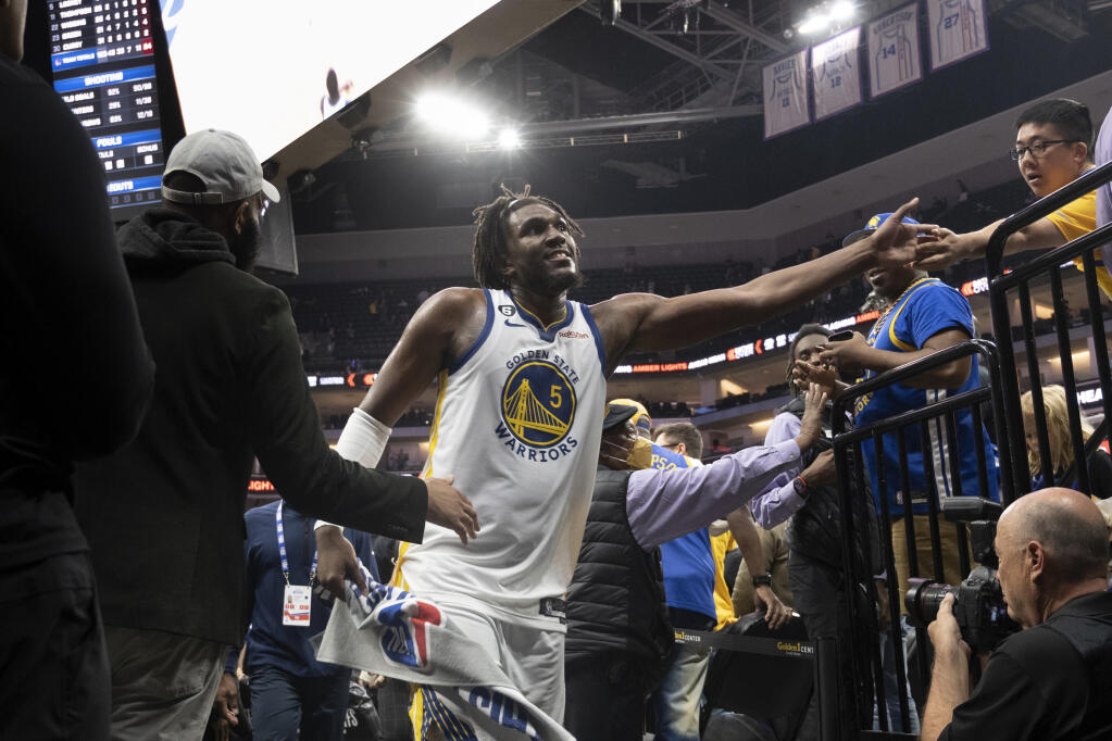 Warriors forward Kevon Looney leaves the floor following the team’s victory Wednesday in Game 5 of their first-round playoff series against the Kings in Sacramento. (José Luis Villegas / ASSOCIATED PRESS)