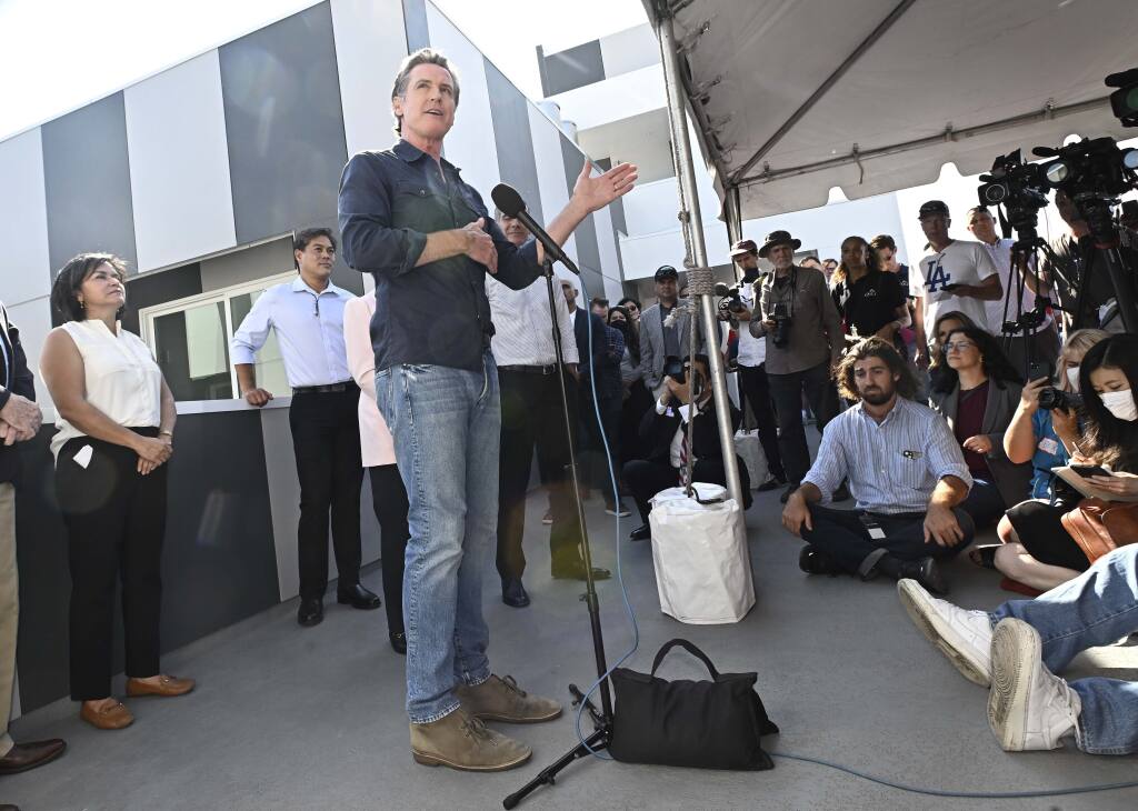 California Gov. Gavin Newsom speaks to the media as he visits a Homekey site along Pico Boulevard as he announces awards for homeless housing projects across the state in Los Angeles on Wednesday, August 24, 2022. (Keith Birmingham/The Orange County Register via AP)