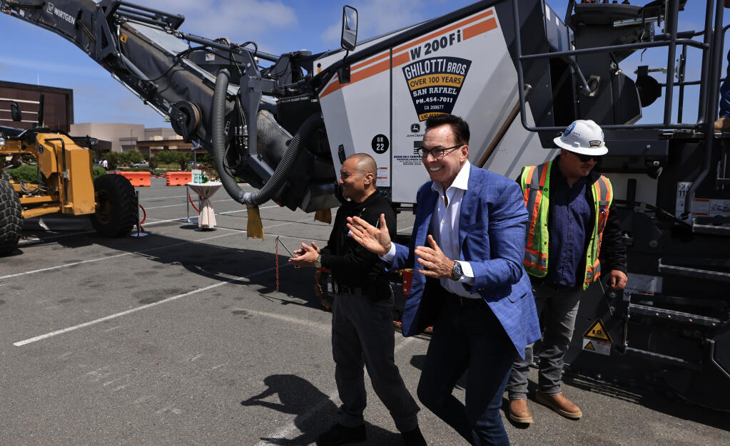 Greg Sarris, the tribal chairman of the Federated Indians of Graton Rancheria, descends from a pavement grinder, Thursday, June 15, 2023, as he heads to a groundbreaking ceremony for an expansion project of the Graton Resort and Casino near Rohnert Park. (Kent Porter / The Press Democrat)
