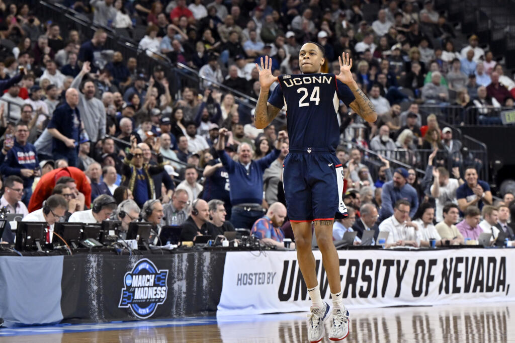 UConn guard Jordan Hawkins celebrates after making a three-point basket in the second half of Saturday’s Elite Eight game against Gonzaga in the West Region final of the NCAA Tournament in Las Vegas. (David Becker / ASSOCIATED PRESS)