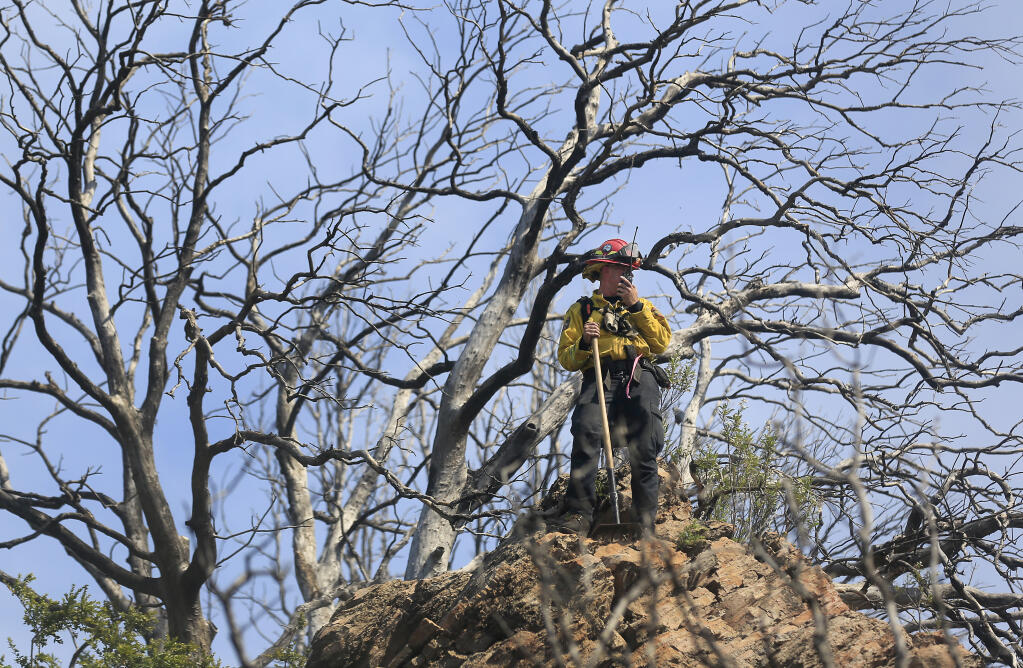 Cal Fire Capt. Frizelle directs dozer operators from a high vantage point, Thursday, April 29, 2021 on the Sky fire near Lower lake. (Kent Porter / The Press Democrat) 2021
