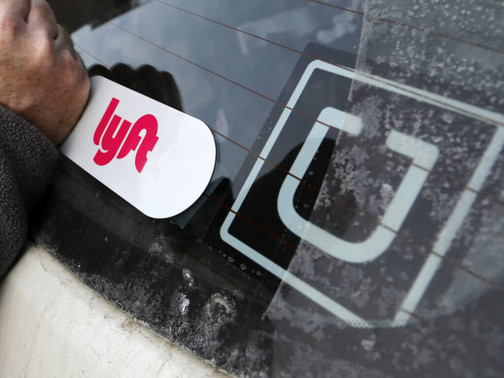 Proposition 22 on the Nov. 3 would allow drivers for Uber, Lyft and other app-based companies to be independent contractors. (GENE J. PUSKAR / Associated Press, 2018)