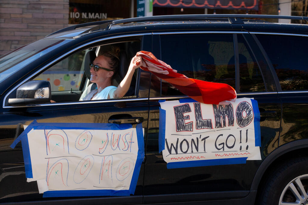 Supporters of keeping El Molino High School open drive in a caravan through Sebastopol, California, on Saturday, Nov. 14, 2020. (Alvin A.H. Jornada / The Press Democrat)