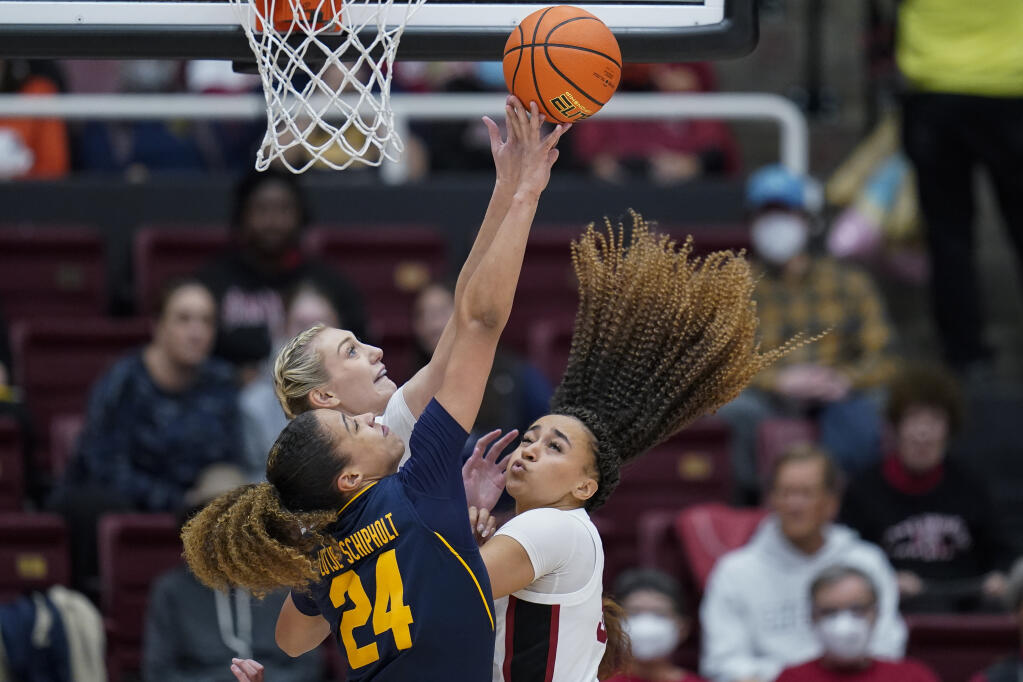 Cal forward Evelien Lutje Schipholt and Stanford forward Cameron Brink, background, compete for a rebound during the first half of Friday’s game in Stanford. At right is Stanford guard Haley Jones.(Godofredo A. Vásquez / ASSOCIATED PRESS)