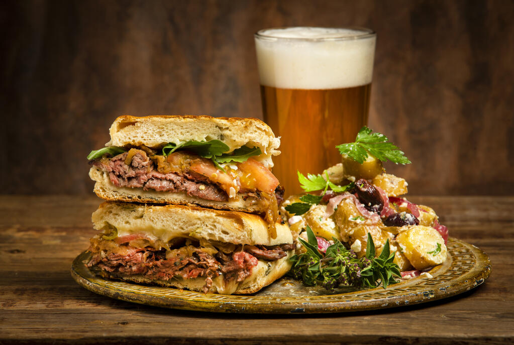 Skirt Steak Panini with Caramelized Onions and Fresh Tomatoes and a side of Fingerling Potato Salad with Kalamata Olives from Dan Lucia of DL Catering in Healdsburg. (John Burgess/The Press Democrat)