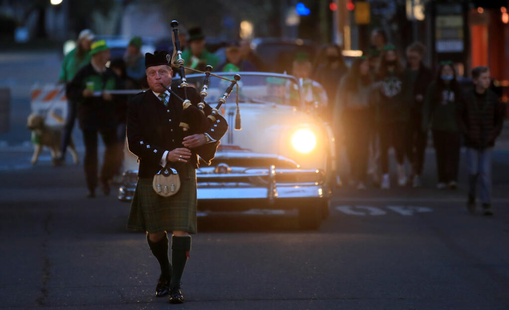 Hal Wilkes, pipe major of the San Francisco Irish, leads the Healdsburg St. Patrick’s Day Parade around the Healdsburg Plaza, Thursday, March 17, 2022. (Kent Porter / The Press Democrat)