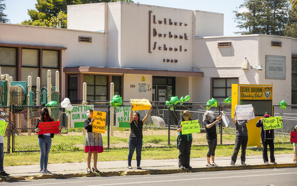 Nearly 40 people showed up to protest the Santa Rosa school board name change proposal at Luther Burbank Elementary School on Monday, May 24, 2021.  (John Burgess / The Press Democrat)