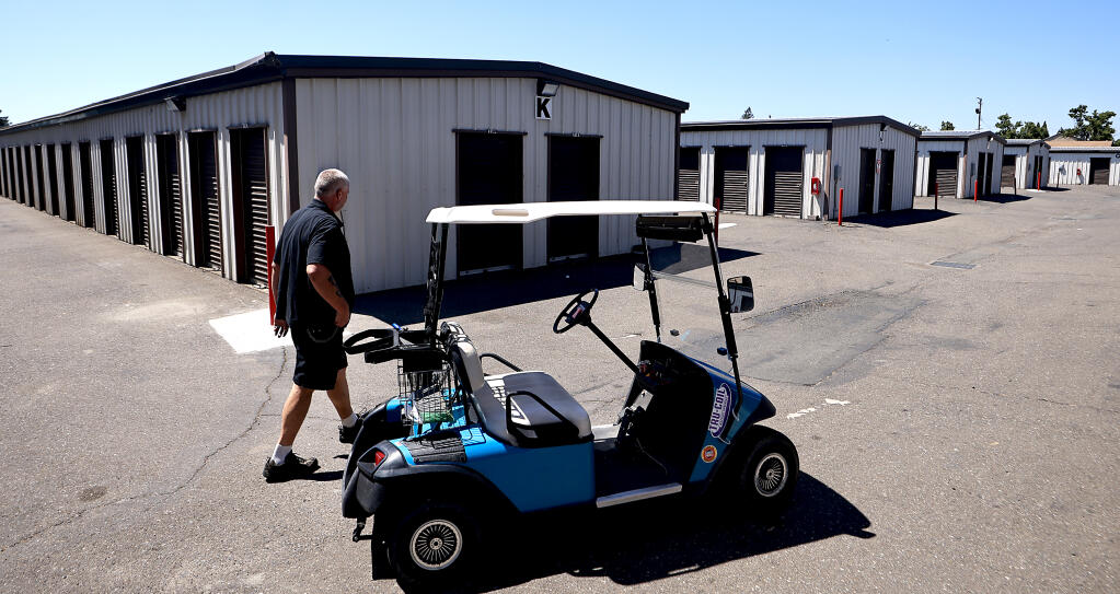 Brian Long patrols the Storage King USA. Along with his wife Kimberly, the couple is managing the Dutton Meadow storage facility in Santa Rosa, Wednesday, July 5, 2023.  (Kent Porter / The Press Democrat)