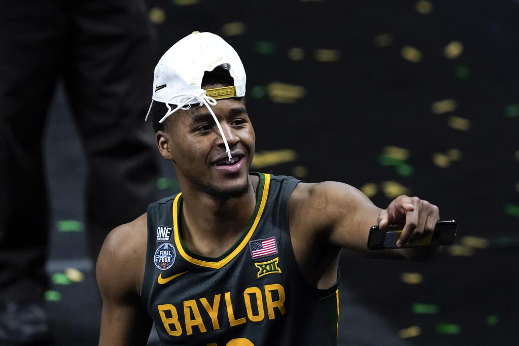 Baylor guard Jared Butler celebrates as he walks off the court after the championship game against Gonzaga in the men's Final Four NCAA college basketball tournament, Monday, April 5, 2021, at Lucas Oil Stadium in Indianapolis. Baylor won 86-70. (AP Photo/Darron Cummings)