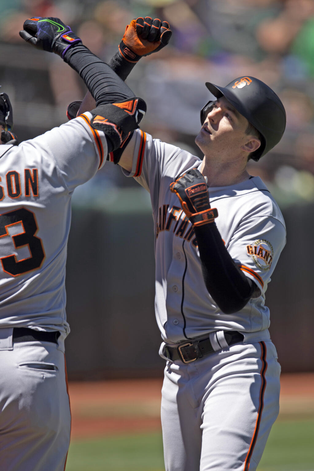 San Francisco Giants' Mike Yastrzemski, right, celebrates his solo home run with teammate Joc Pederson during the third inning of a baseball game against the Oakland Athletics, Sunday, Aug. 7, 2022, in Oakland, Calif. (AP Photo/D. Ross Cameron)